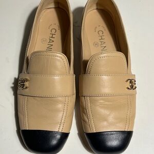 CHANEL Beige Leather Loafers with Black Cap Toe and Gold CC